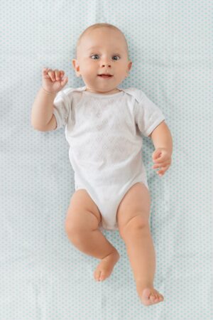 Клеёнка-наматрасник Roxy Kids с резинками-держателями 68х100 см 12